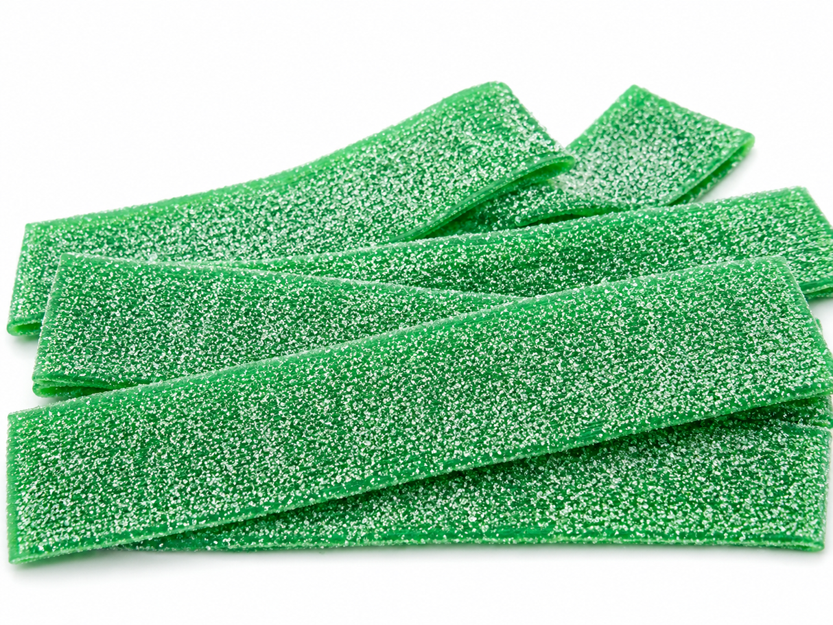 Green apple sour belts loose candy close-up